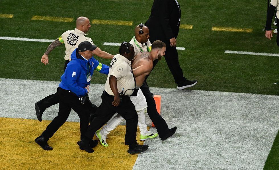 The streaker was dragged off the field