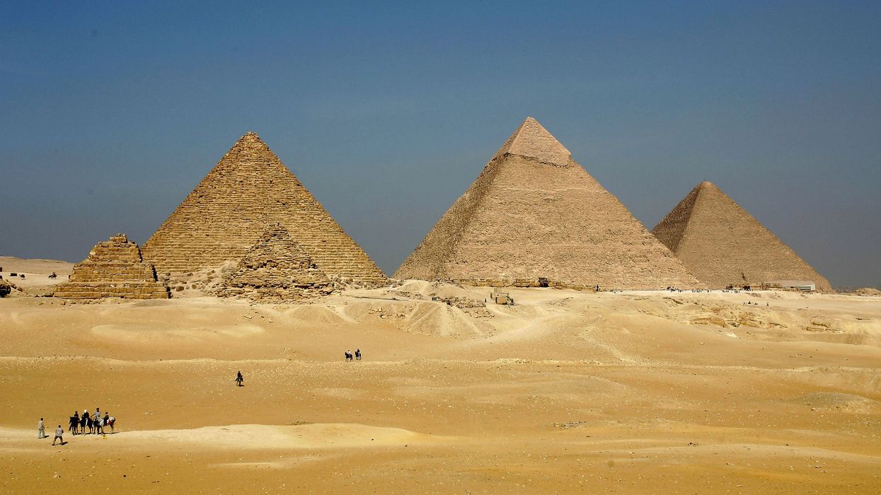 The three large pyramids of Menkaure (L), Khafre (C) and Khufu loom over the horizon at Giza