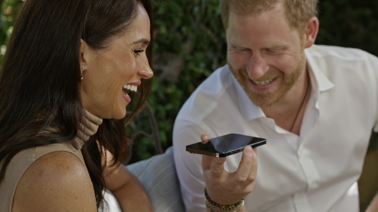 Harry and Meghan look very much in love during latest appearance despite relationship crisis claims