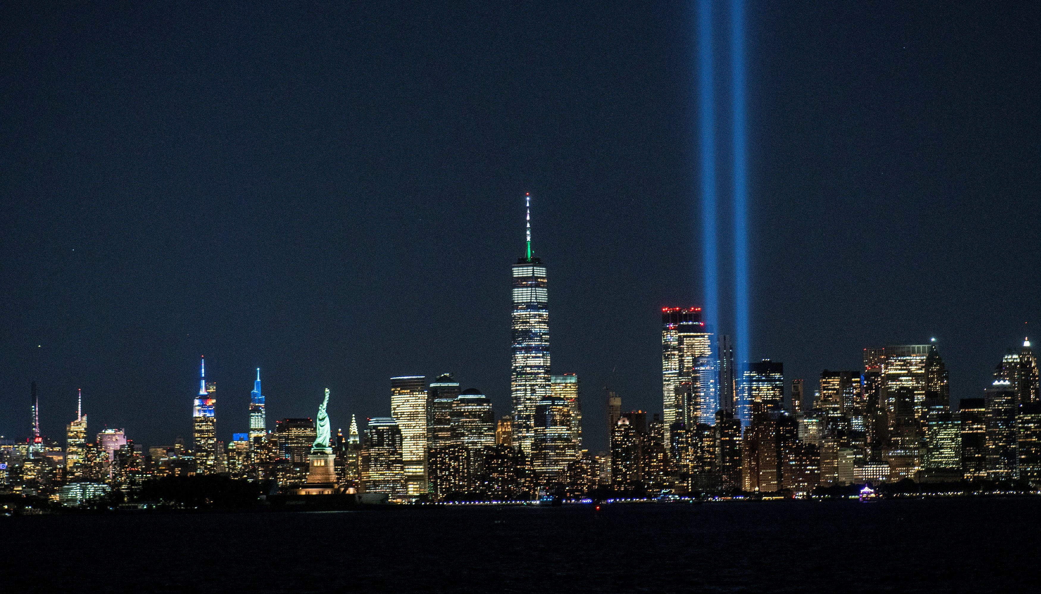 The Tribute in Light installation, the World Trade Center, The Empire State Building, The Statue of Liberty and the skyline of New York are seen ahead of the 20th anniversary of the September 11 attacks in Manhattan.