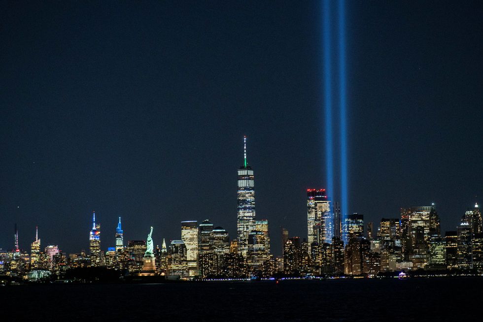 The Tribute in Light installation, the World Trade Center, The Empire State Building, The Statue of Liberty and the skyline of New York are seen ahead of the 20th anniversary of the September 11 attacks in Manhattan.