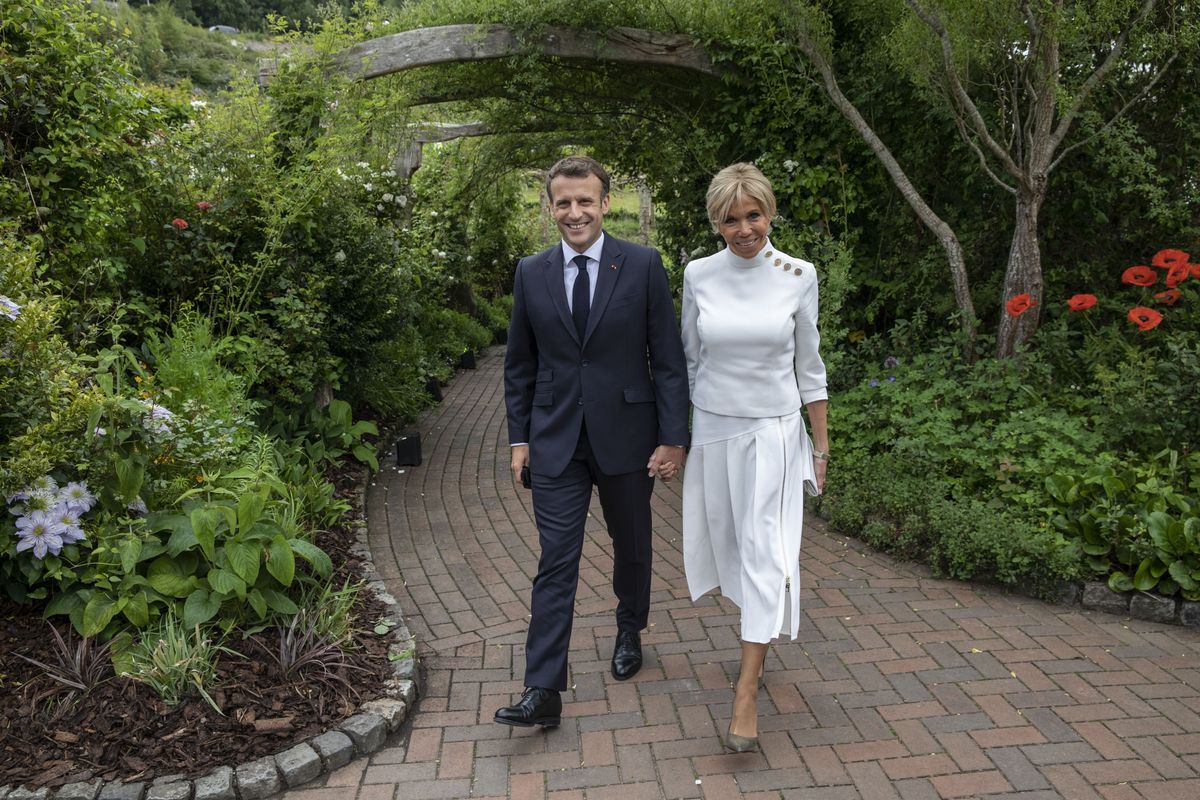 The two walking through a garden