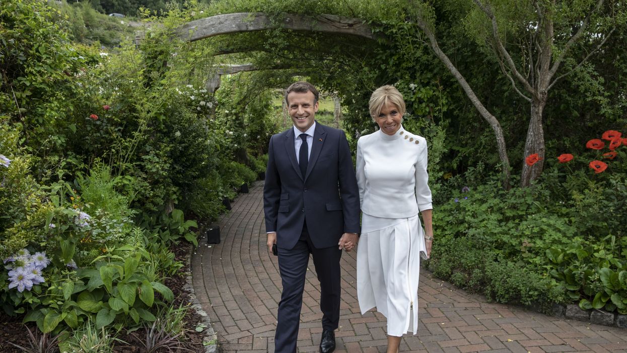 The two walking through a garden