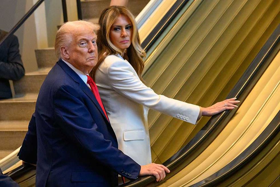 The US President and First Lady aboard the 'sabotaged' escalator