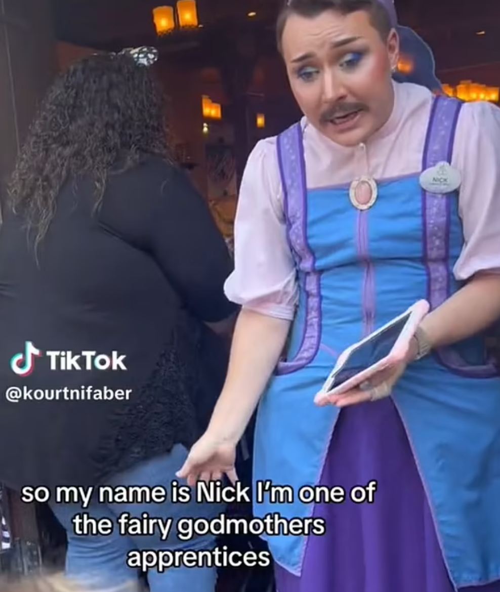 The viral clip shows the Mustached Disney employee welcoming a little girl to the store, dressed up as a 'Fairy Godmother's apprentice'