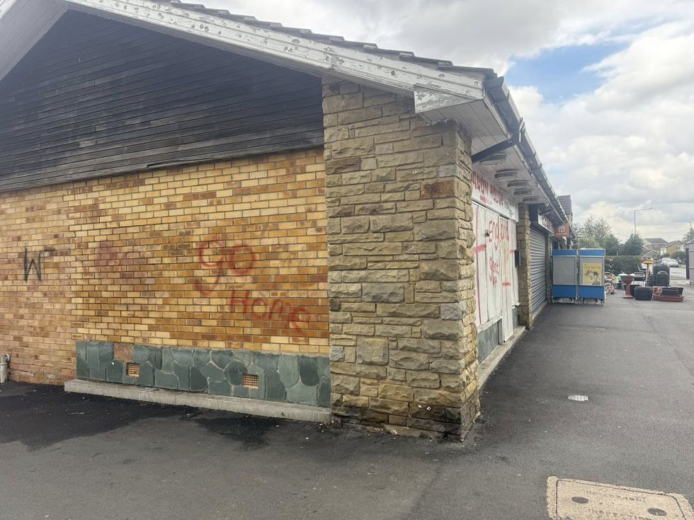 The words 'go home' were spray-painted on the side of the takeaway
