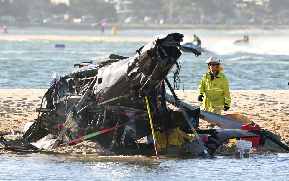 The wreckage of a helicopter is seen following a collision near Seaworld, on the Gold Coast, Australia, January 2, 2023. AAP Image/Dave Hunt via REUTERS ATTENTION EDITORS - THIS IMAGE WAS PROVIDED BY A THIRD PARTY. NO RESALES. NO ARCHIVE. NEW ZEALAND OUT. NO COMMERCIAL OR EDITORIAL SALES IN NEW ZEALAND. AUSTRALIA OUT. NO COMMERCIAL OR EDITORIAL SALES IN AUSTRALIA