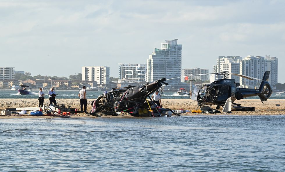 The wreckage of two helicopters are seen following a collision near Seaworld, on the Gold Coast, Australia, January 2, 2023. AAP Image/Dave Hunt via REUTERS ATTENTION EDITORS - THIS IMAGE WAS PROVIDED BY A THIRD PARTY. NO RESALES. NO ARCHIVE. NEW ZEALAND OUT. NO COMMERCIAL OR EDITORIAL SALES IN NEW ZEALAND. AUSTRIA OUT. NO COMMERCIAL OR EDITORIAL SALES IN AUSTRIA