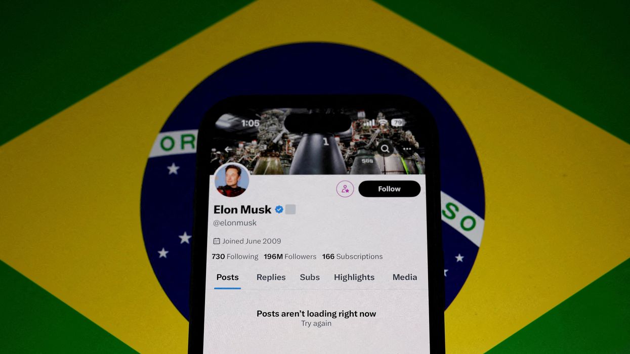 The X account of Elon Musk in seen blocked on a mobile screen