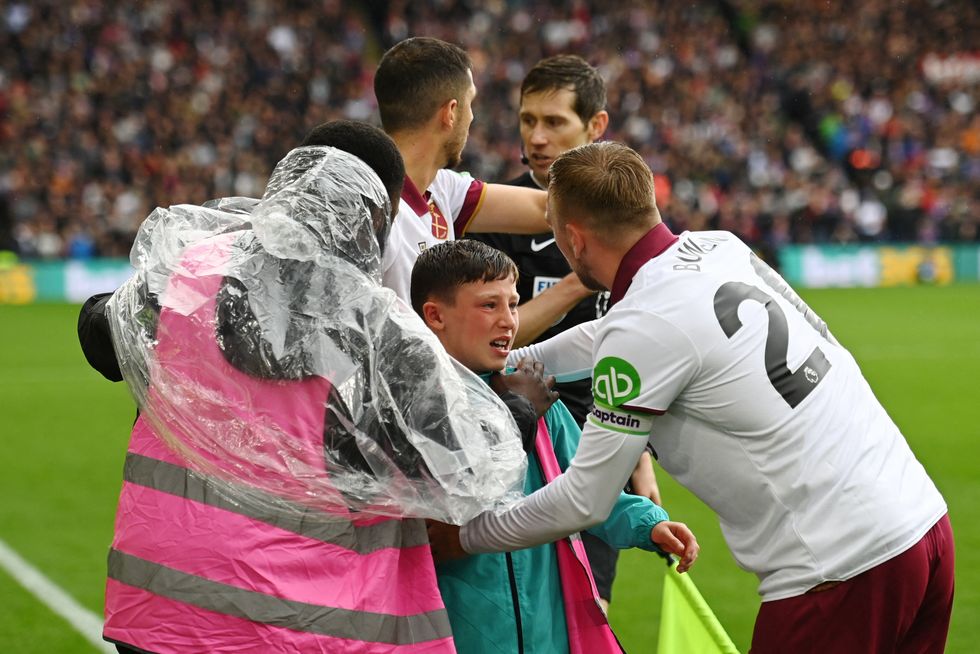 The young ball boy was led away by stadium security