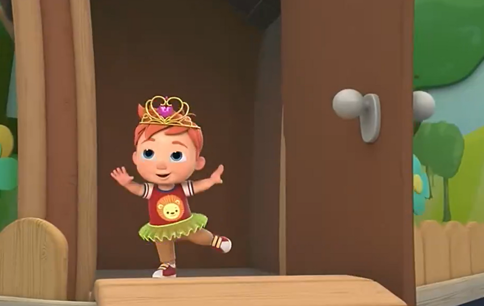 The young boy struggles with what outfit to wear to dance in.