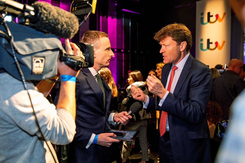 THESE PICTURES ARE AVAILABLE FOR EDITORIAL USE ONLY UNTIL DECEMBER 19TH 2019 Handout photo issued by ITV of Chancellor of Brexit Party Chairman Richard Tice (right) in the 'spin room' during the election head-to-head debate between, Prime Minister Boris Johnson and Labour Party leader Jeremy Corbyn, filmed at MediaCityUK, in Salford, Manchester, prior to the General Election.