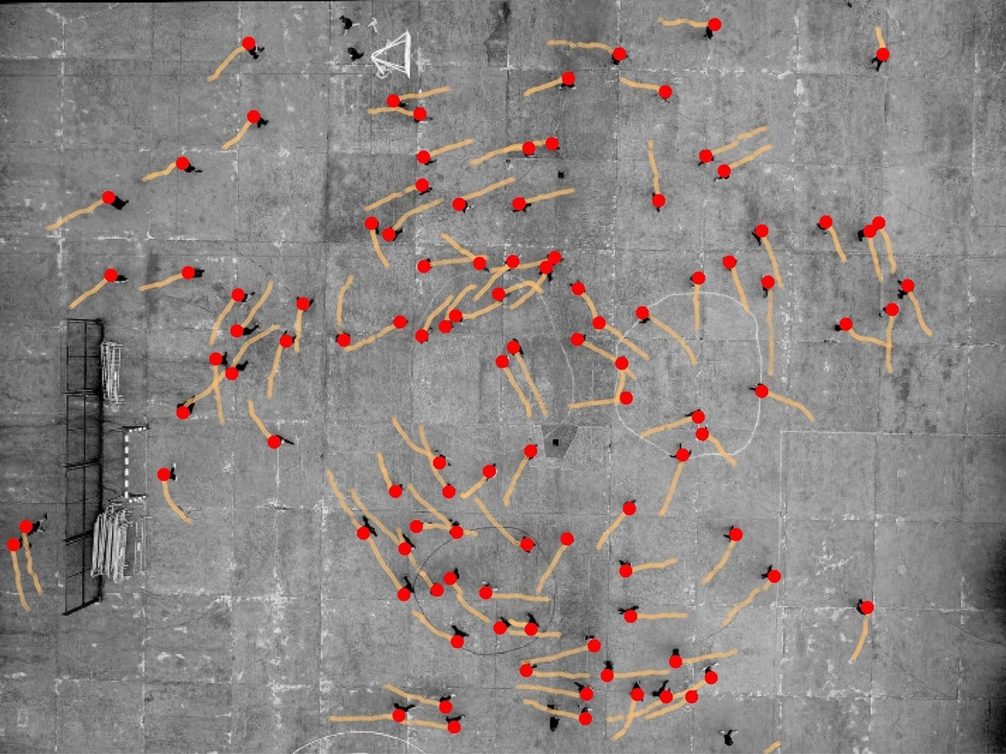 This annotated image shows a schoolground in Spain and the motions of teenage participants as indicated by the dots and lines