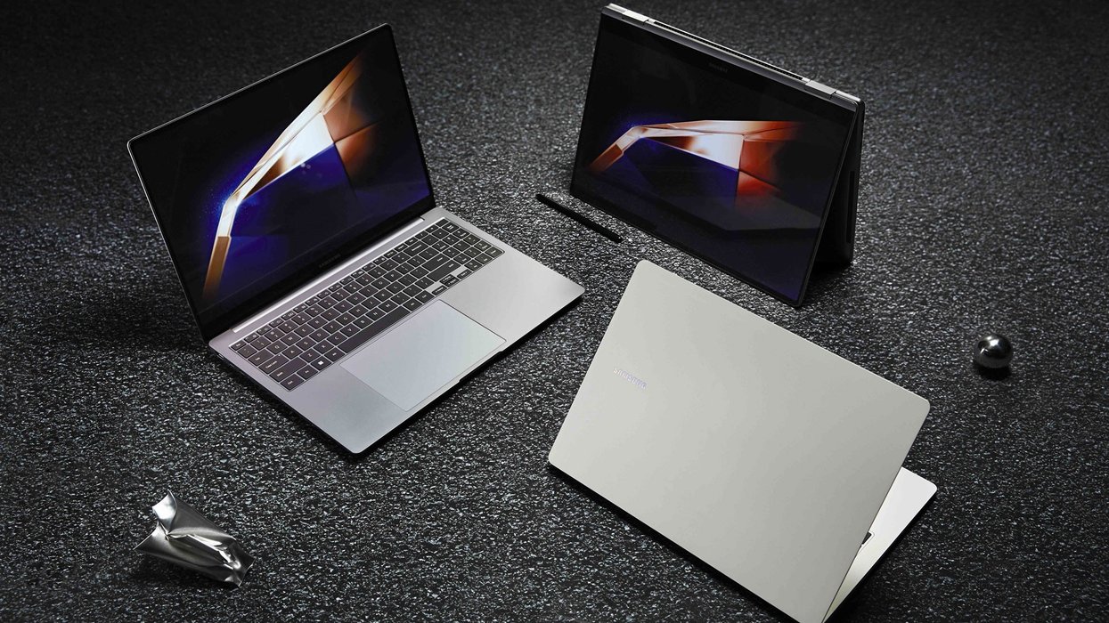 three galaxy book 4 models pictured on a textured floor with metal cubes surrounding them