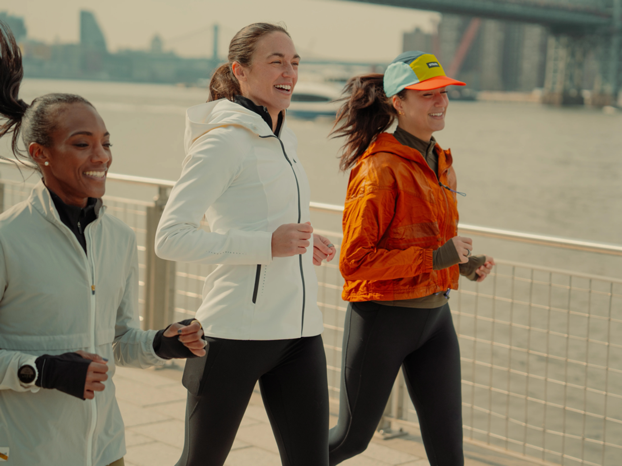 three runners pictured in new york city exercising