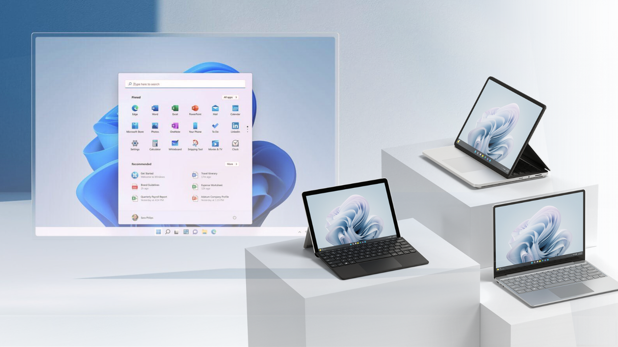 three surface PCs are pictured on the right-side with a screenshot from Windows 11 in the background