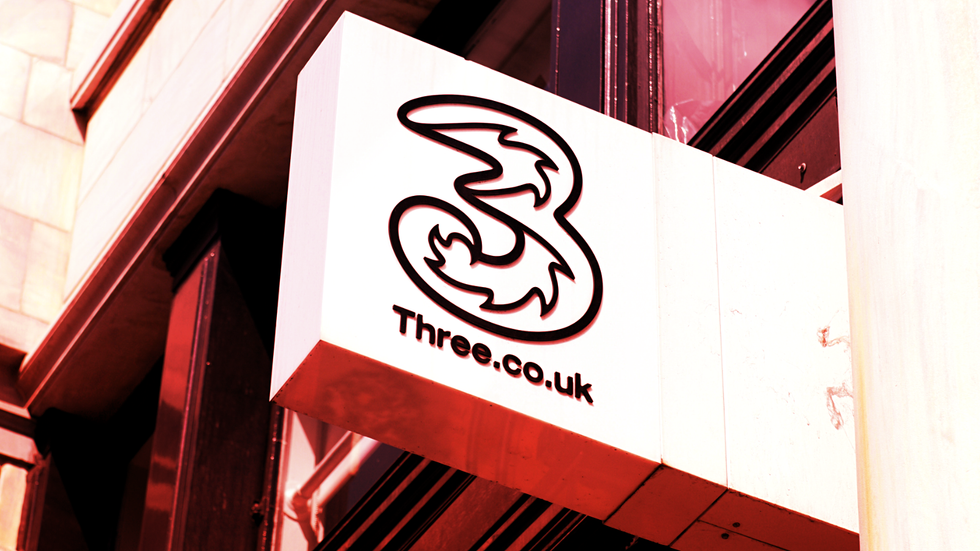 Three UK mobile shop sign outside of UK high street store