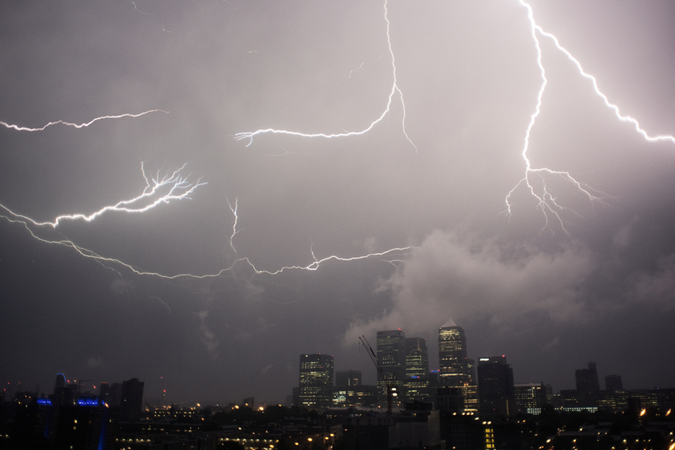 Thunder and lightning over Canary Wharf at night