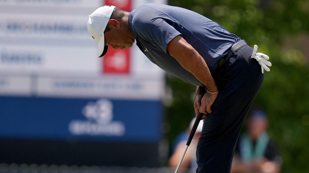 Tiger Woods missed the cut by two shots