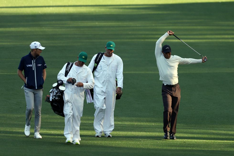 Tiger Woods was seen stretching while out on the course
