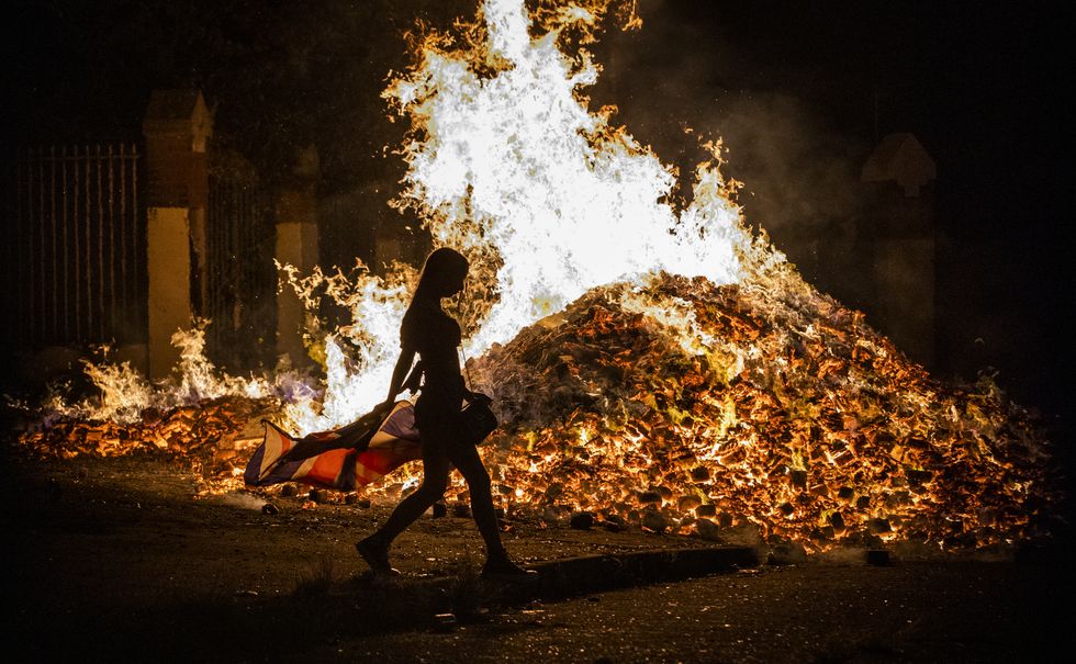Tiger's Bay 'Eleventh Night' bonfire in Belfast alight in the early hours of Monday morning. More than 230 such bonfires were lit in Loyalist areas across Northern Ireland between Friday and Sunday nights as part of a tradition to mark the anniversary of the Protestant King William's victory over the Catholic King James at the Battle of the Boyne in 1690.