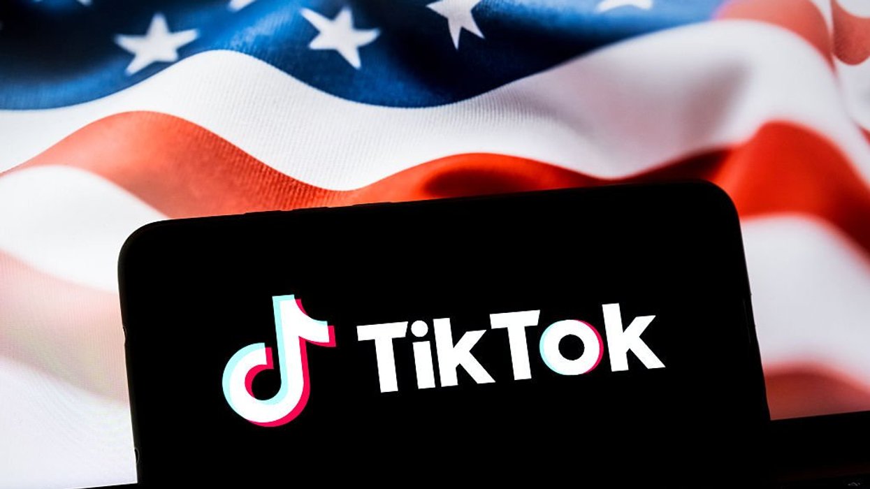 TikTok logo on phone in front of US flag