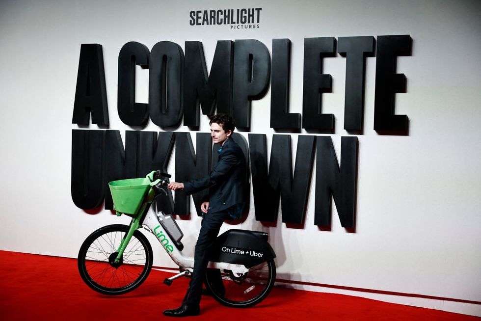 Timothee Chalamet with an e-bike at the premiere of A Complete Unknown