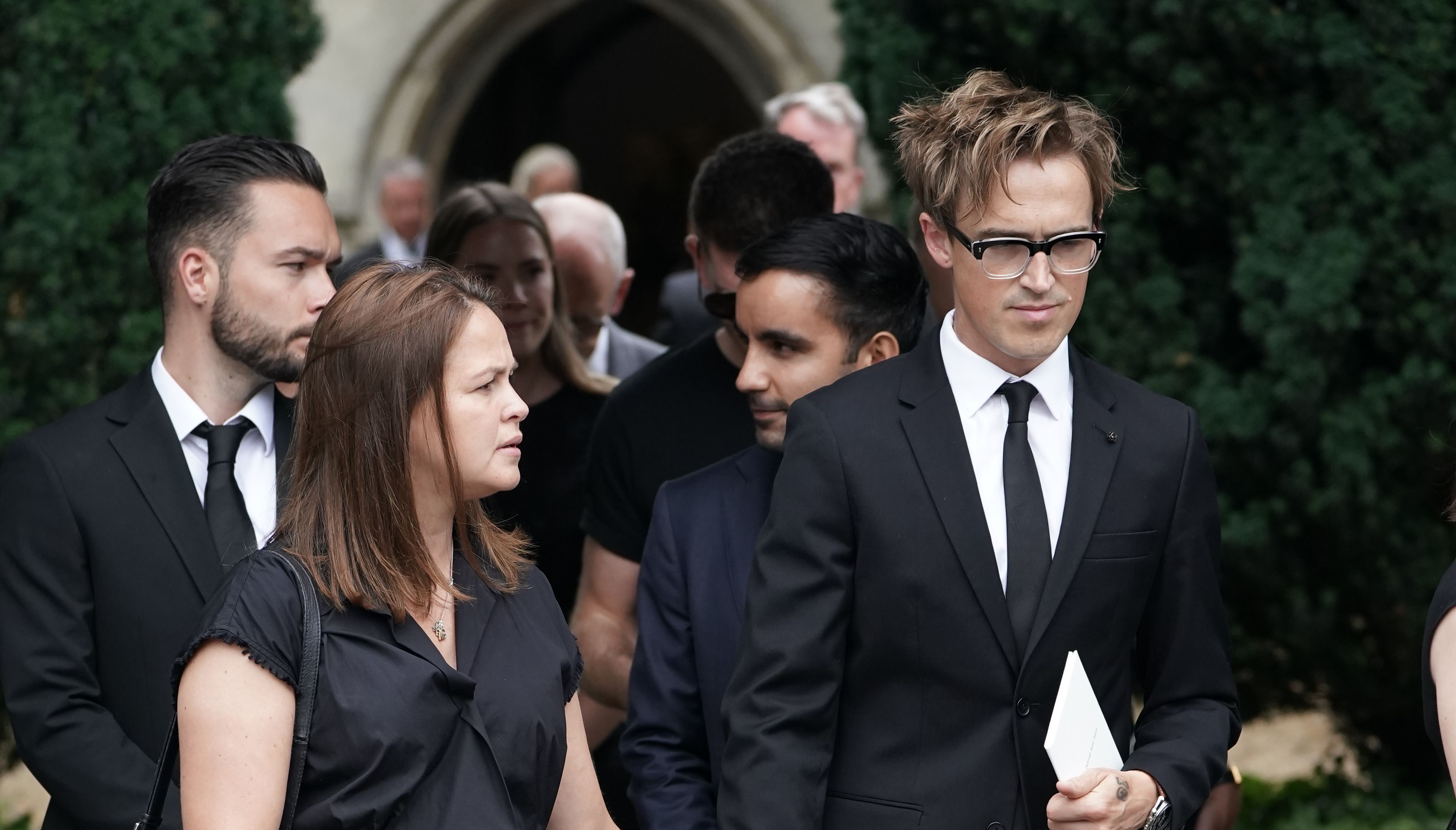 Tom and Giovanna Fletcher leaving the funeral service of Dame Deborah James at St Mary's Church in Barnes, west London. Picture date: Wednesday July 20, 2022.