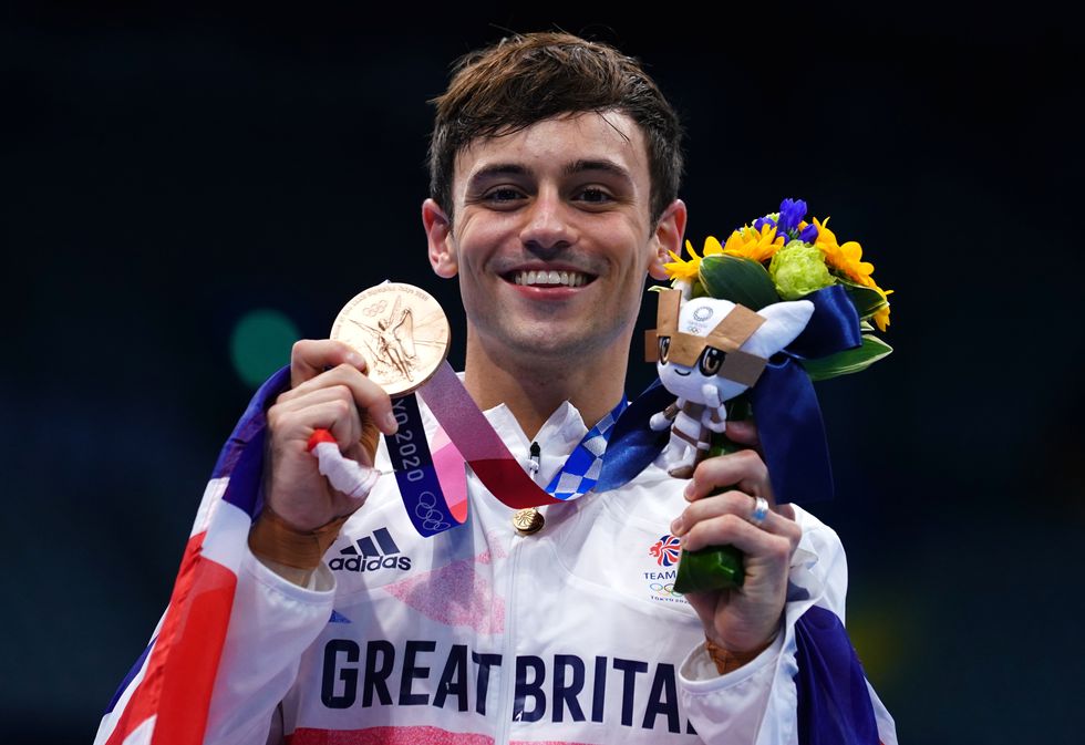Tom Daley of Great Britain with a bronze medal following the Men's 10m Platform Final at the Tokyo Aquatics Centre on the fifteenth day of the Tokyo 2020 Olympic Games in Japan.