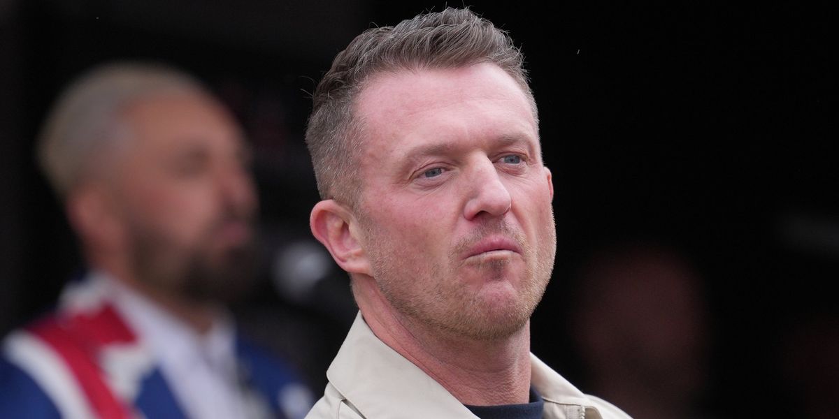Tommy Robinson detained by police at Heathrow airport under counter-terrorism laws