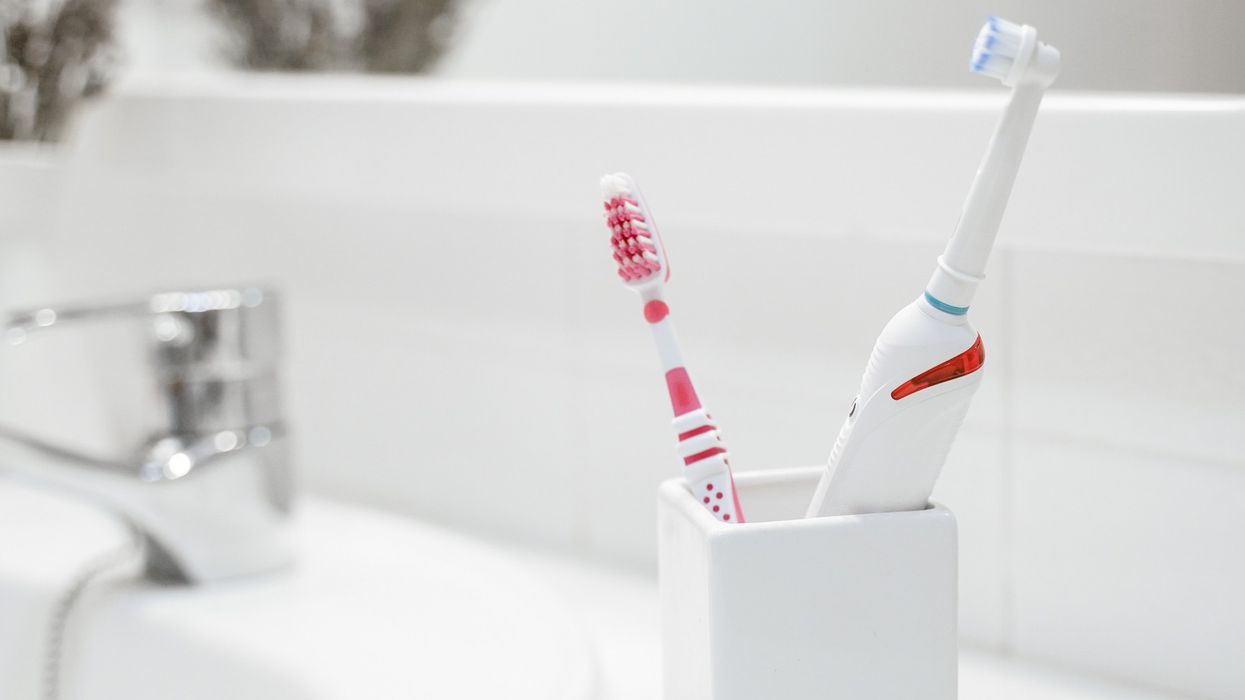 Toothbrushes in bathroom