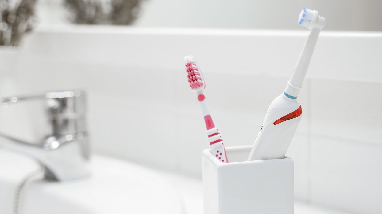 Toothbrushes in bathroom