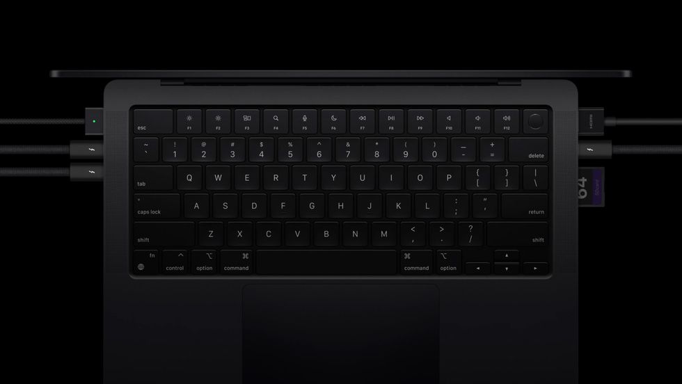 top down view of the 14-inch macbook pro with thunderbolt cables plugged in