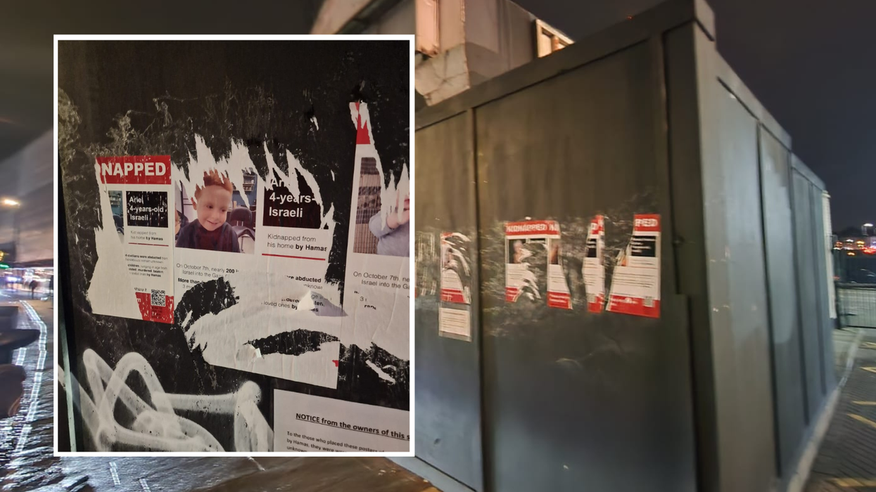 Torn posters/boraded up shop