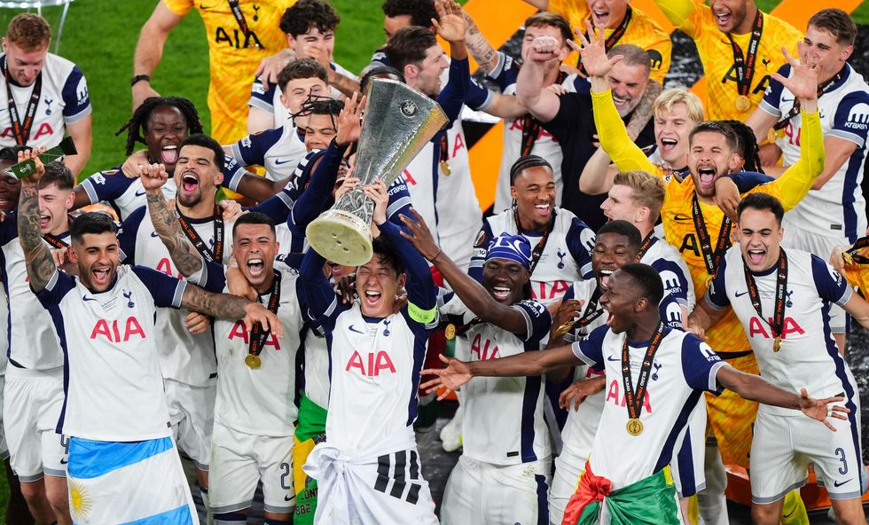 Tottenham players lifting the Europa League trophy