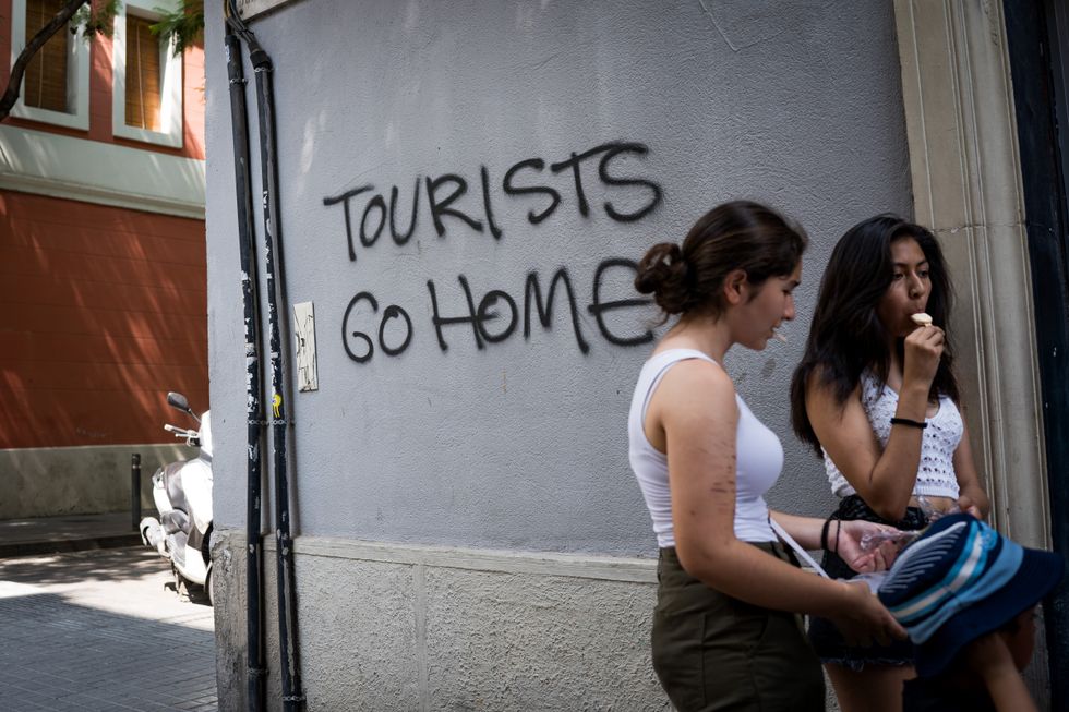 'Tourists go home' graffiti in Barcelona