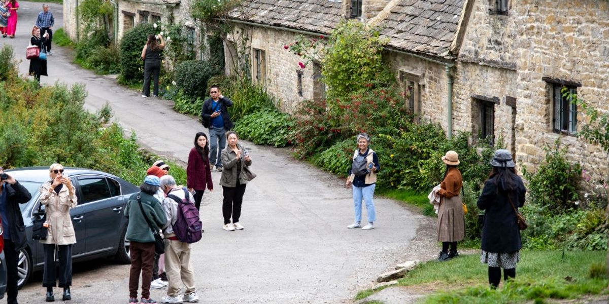 NextImg:Neighbour row erupts as 'England's most beautiful village' launches fightback against tourist invasion