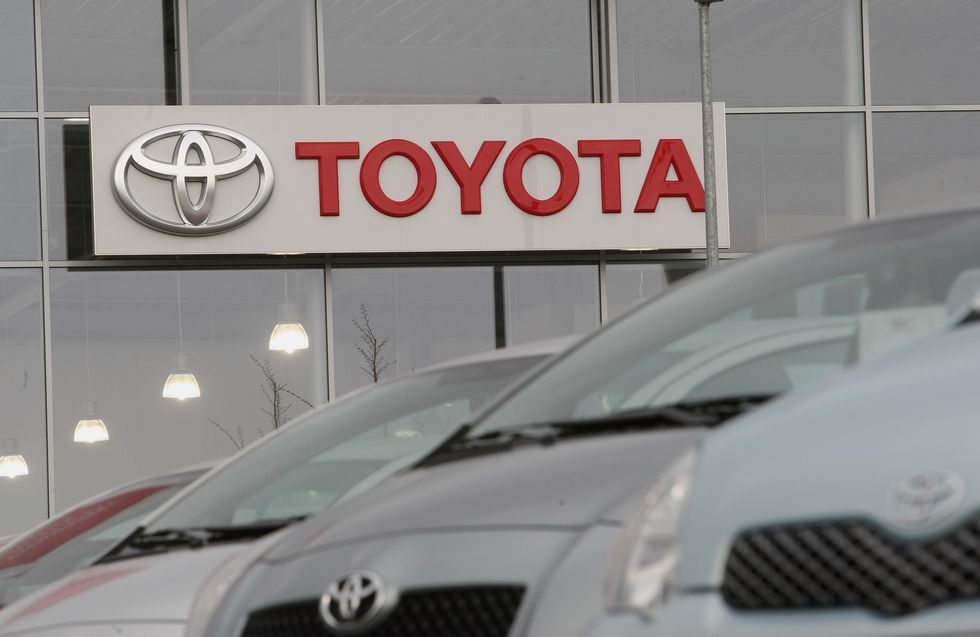 Toyota cars are offered for sale at a car dealership