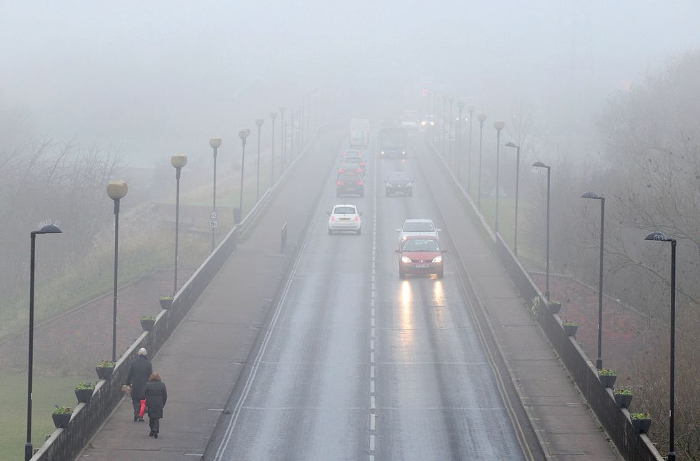 Traffic at foggy St Peter's Bridge, Burton On Trent, Staffordshire. Freezing fog played havoc with travel today, with flights cancelled, roads jammed and delays on main line rail and Tube services.