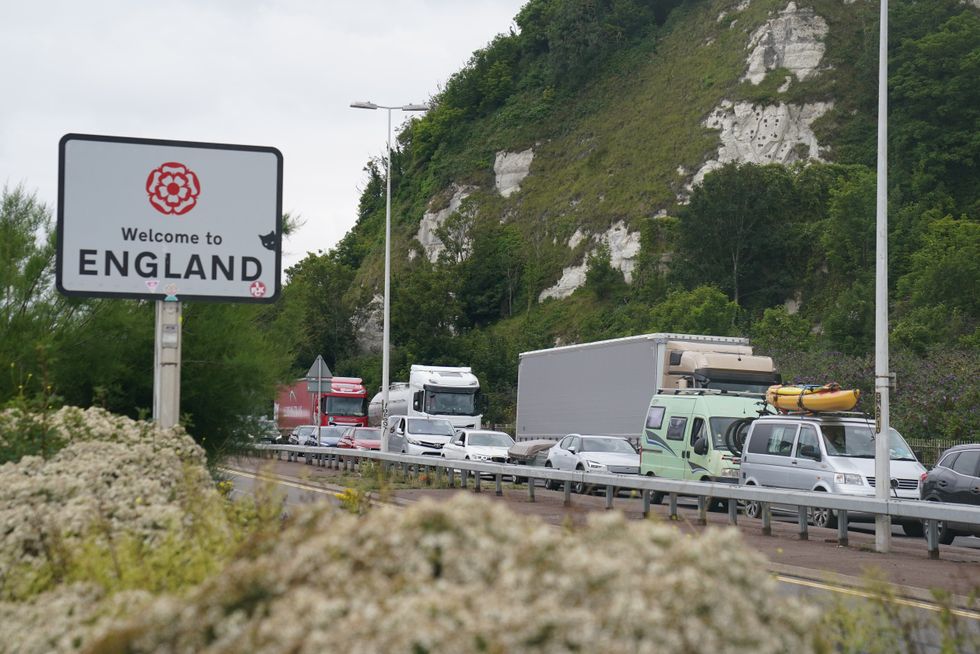 Traffic behind a Welcome to England sign at Dover