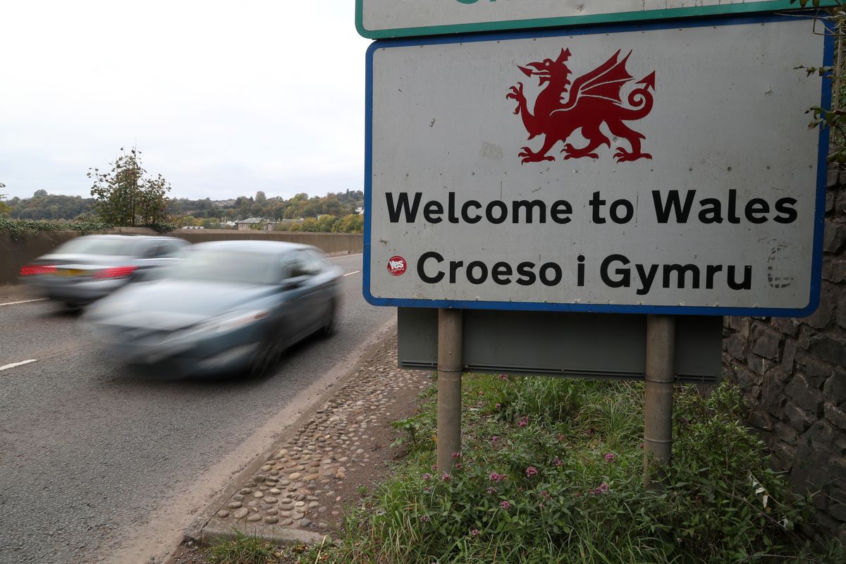 Traffic crosses the England/Wales border past a Welcome to Wales sign near Chepstow in Monmouthshire