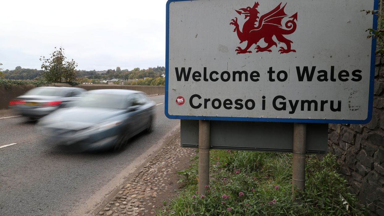 Traffic crosses the England/Wales border past a Welcome to Wales sign near Chepstow in Monmouthshire
