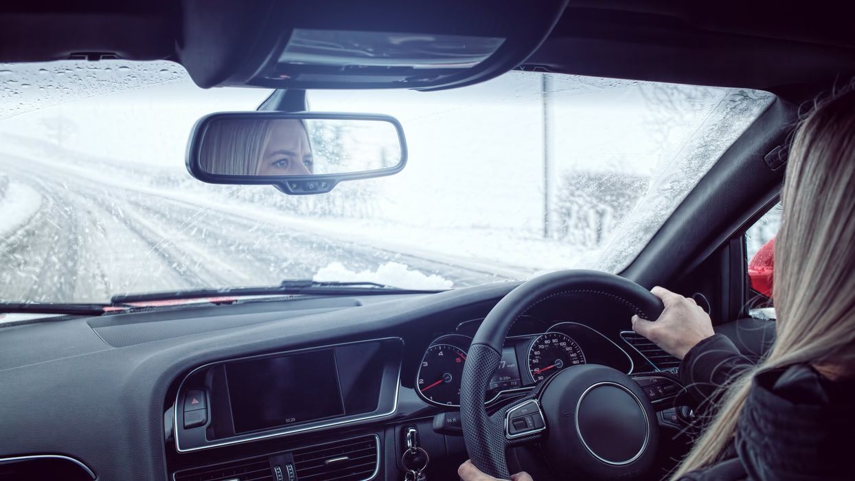  Traffic drives through falling snow on Lanark Road in Edinburgh