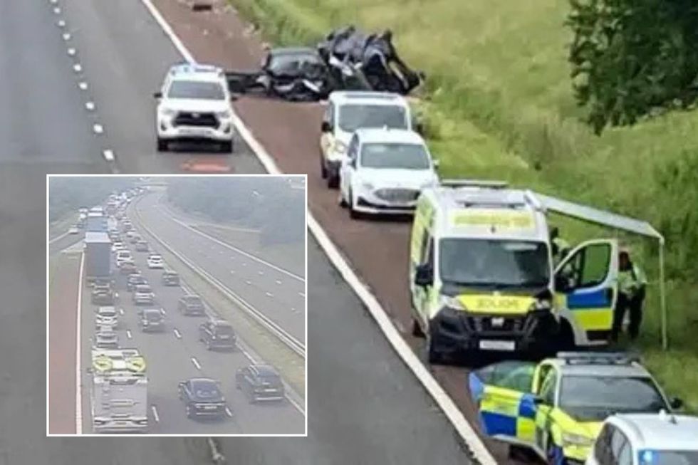 Traffic on the M6 and police officers responding to an accident on the M6