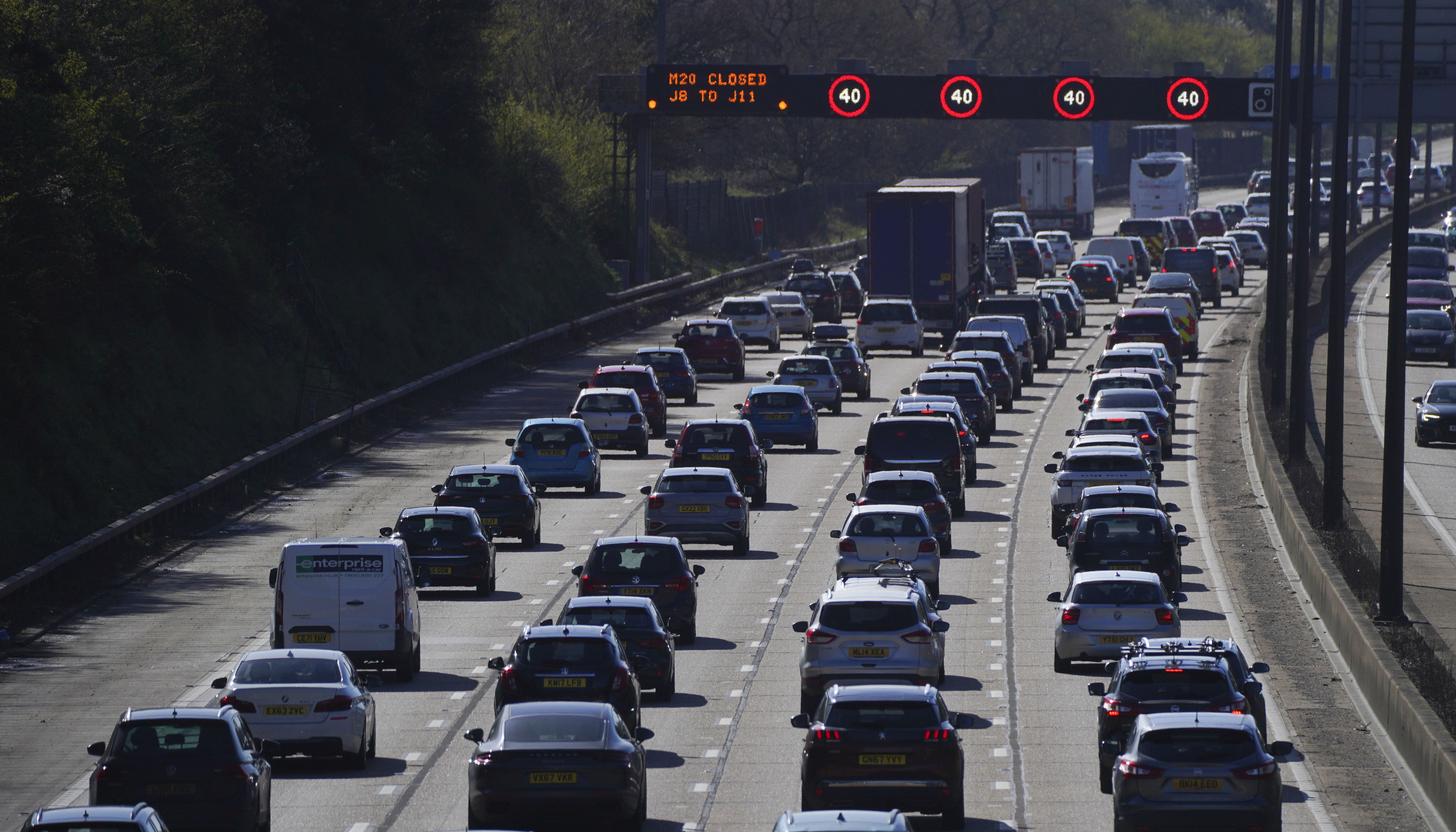 Traffic queues on the M25 near Addlestone, Surrey, as the getaway starts in earnest as schools close for Easter.