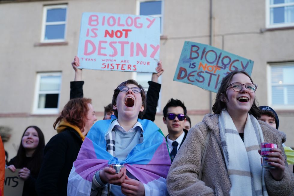 Trans rights activists take part in a demonstration outside Portobello Library, Edinburgh, where parents are attending a meeting, organised by Concerned Adults Talking Openly About Gender Identity Ideology, to discuss transgender ideology in Scottish schools. Picture date: Tuesday March 14, 2023.