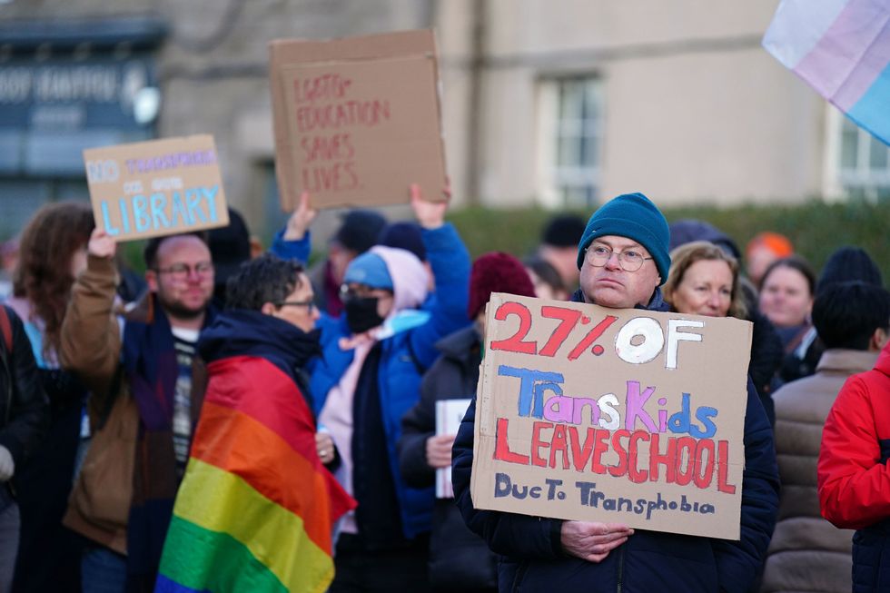 Trans rights activists take part in a demonstration outside Portobello Library, Edinburgh