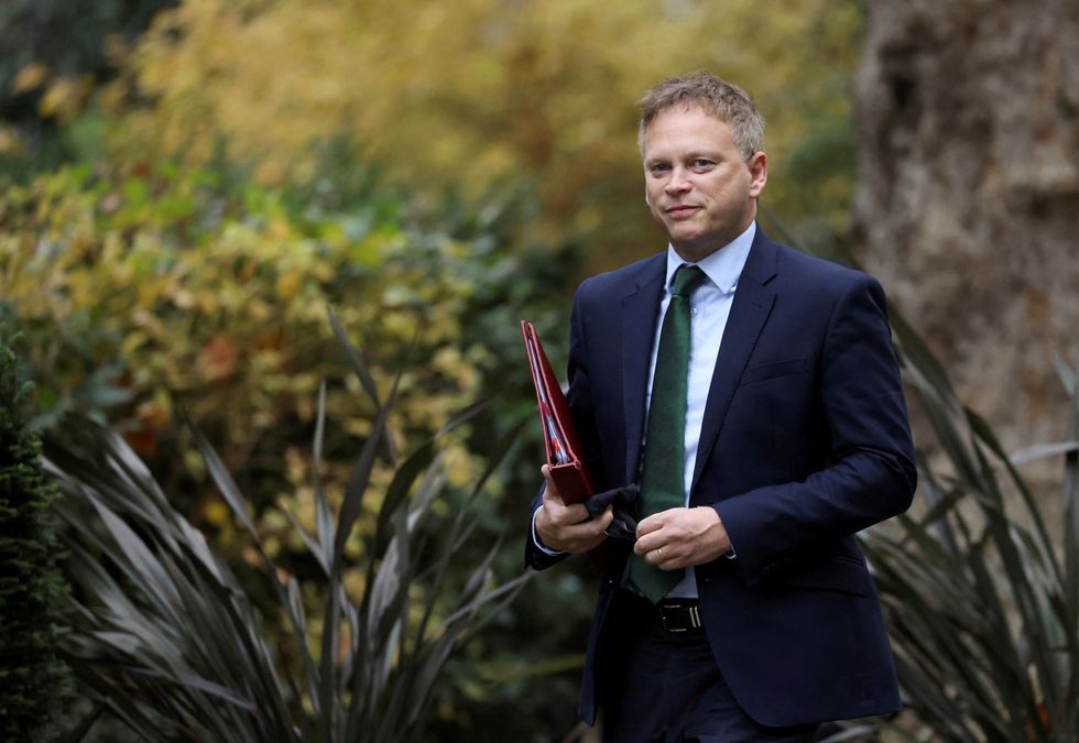 Transport Secretary Grant Shapps walks outside Downing Street in London, Britain November 30, 2021.