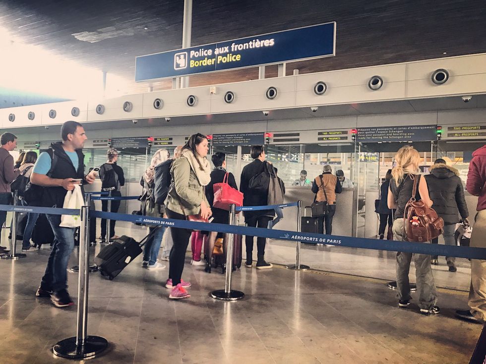 Travellers queuing at border patrol