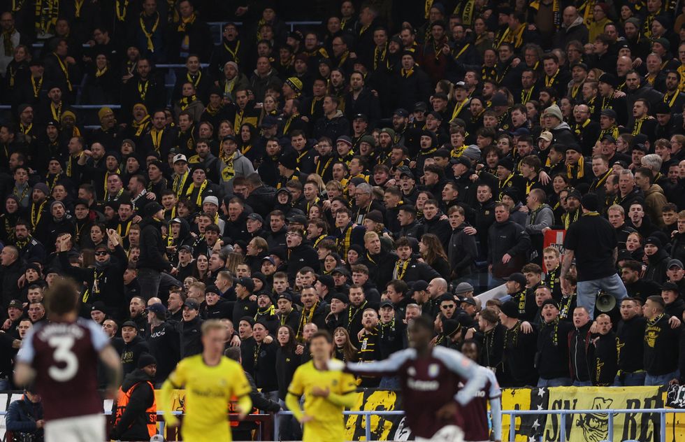 Travelling fans appeared to clash with police with reports that seats were being ripped out of the stadium